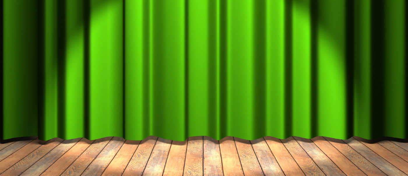 Green curtain on a stage.