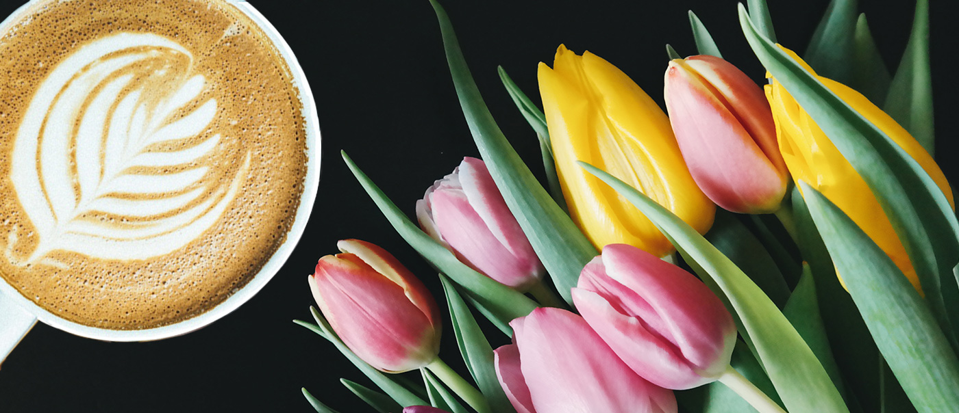 Coffee cup and tulips