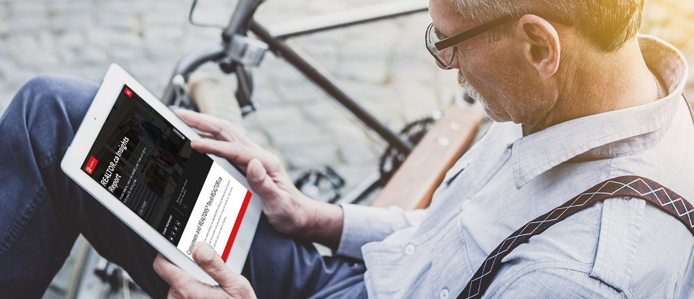 Man looking at Insights Report on tablet
