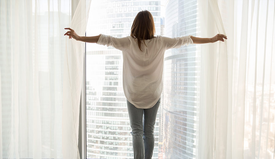 Woman standing in condo