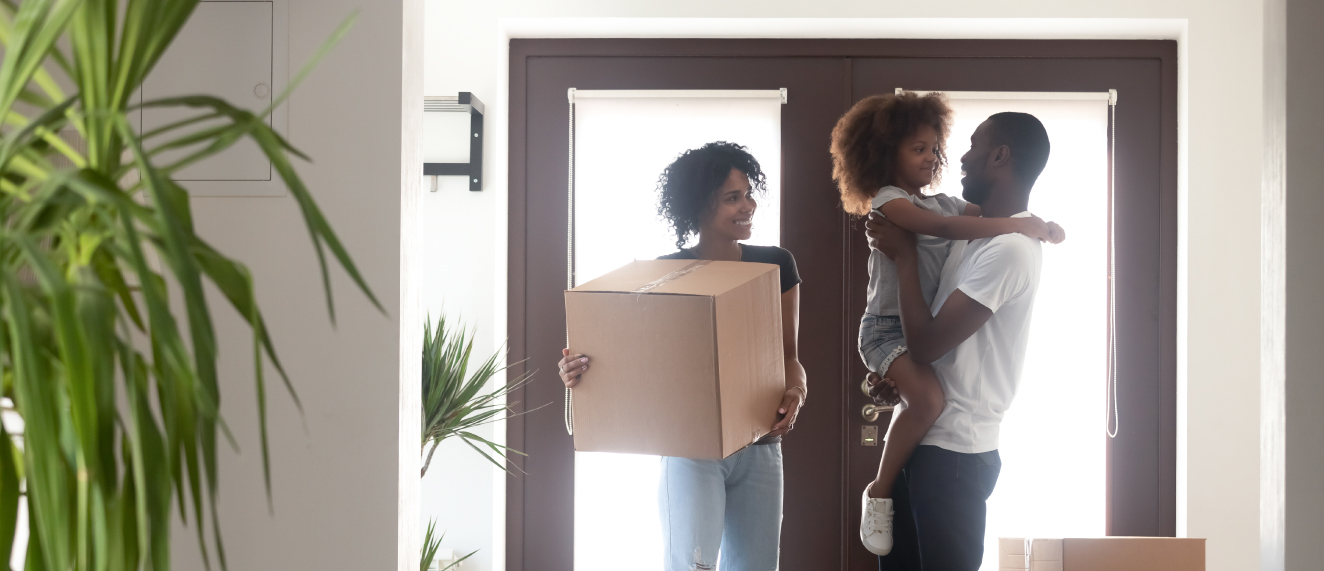 Black family moving into new home.
